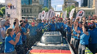 (The SolarCar team celebrating as they crossed the finish line first in the Cruiser Class. Picture from Hochschule Bochum.)