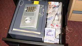 Criminal cash stashed in a filing cabinet