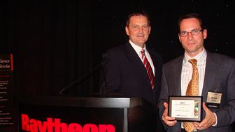 Cavotec USA's Mike Larkin and Michael Majewski receive Supplier Excellence Award from Raytheon Integrated Defense Systems
