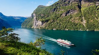 PLANS FOR JUNE RESTART: Hurtigruten hopes to gradually restart operations from June - and again operate cruises to places such as Norway's iconic Geiranger fjord. Photo: AGURTXANE CONCELLON/Hurtigruten