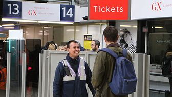 Customer Service Host Antonio Tapia welcomes a passenger at the Gatwick Express portal at London Victoria