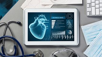 A tablet showing medical information lies on a desk with medical instruments around it. Royalty-free stock photo ID: 572383276.