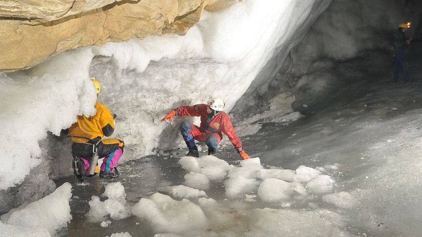 Dr Sebastian Breitenbach exploring possible passages in an ice-filled cave in Siberia