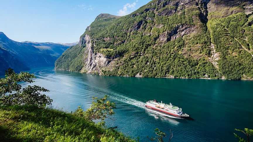 PLANS FOR JUNE RESTART: Hurtigruten hopes to gradually restart operations from June - and again operate cruises to places such as Norway's iconic Geiranger fjord. Photo: AGURTXANE CONCELLON/Hurtigruten
