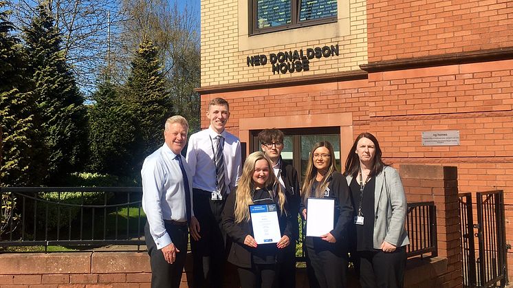 ng homes staff; Tony Sweeney, Depute Director (Corporate Services), Alan Nicolson, CSO, Lucy Brown, CSO, Connor Hazlett, CSO/Housing Assistant, Danielle Quinn, Housing Officer, Karen Johnson, Housing Manager proudly display the IIYP Gold Certificate