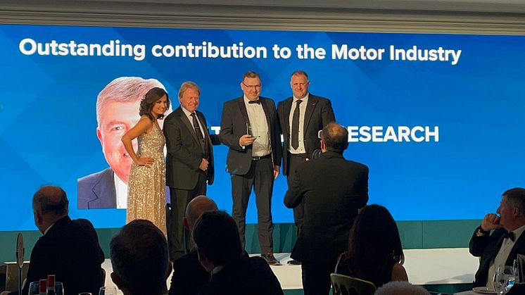 Dean Lander collected the award on behalf of Thatcham Research (L-R ITV's Nina Hossain, IMI chief exec Steve Nash, Dean Lander and award sponsor Gavin White, CEO Autotech)