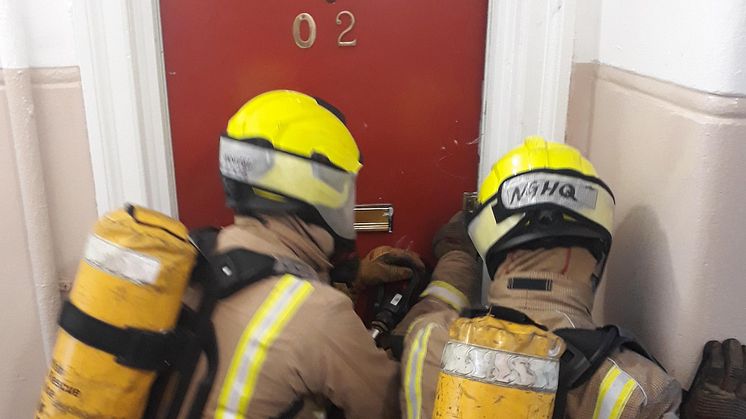 SFRS Firefighters prepare to enter the ng homes property
