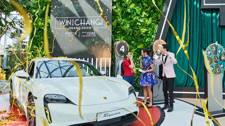 Amanda Marie Siow (left) celebrates with a shower of streamers as she is announced as the Grand Prize winner of the ‘Win With Changi’ campaign