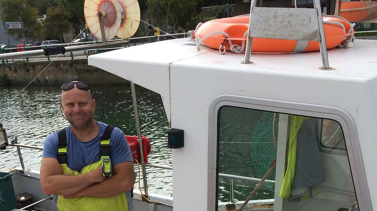 Fisherman Simon Jones on his Fast Worker 19 with his ACR ResQLink Personal Locator Beacon 
