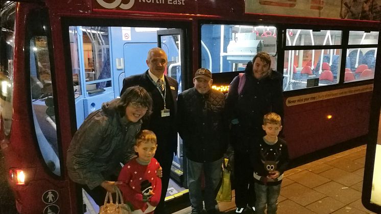 Go North East driver Mark with the Christmas party attendees from Gateshead People and Guidepost