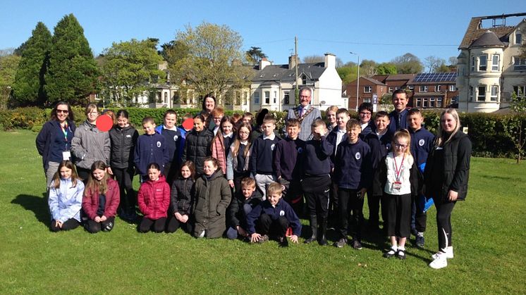Pictured is the children from Olderfleet Primary School at Curran Park Larne with Mayor Councillor William McCaughey.  