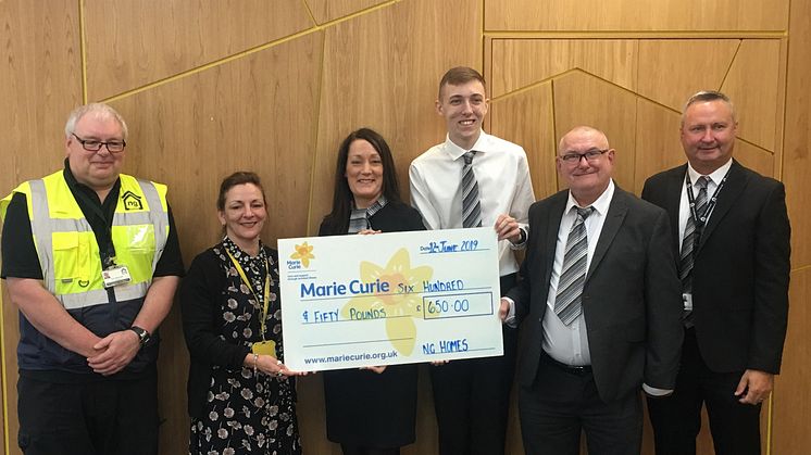 Amanda Casey, Community Fundraiser at Marie Curie receiving their cheque from ng homes staff - Concierge Gerry McDonald, Housing Manager Sharon Hazlett, CSO Alan Nicolson, Chairperson John Thorburn and Concierge & Property Manager Colin Leverage