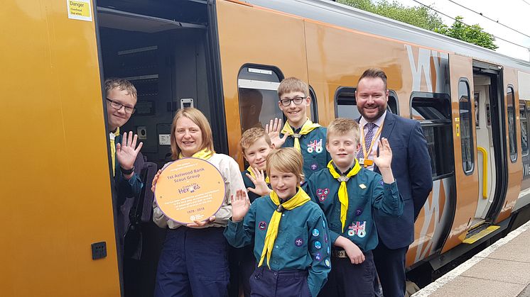 Group leader for 1st Astwood Bank Scouts, Sally Payne and area conductor manager for West Midlands Railway, Paul Cassidy, with some of the Scouts receiving their Cross City Heroes award at Redditch railway station