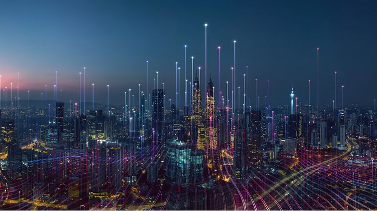 Smart city at night, with coloured lights rising from buildings. Royalty-free stock photo ID: 1499306735.