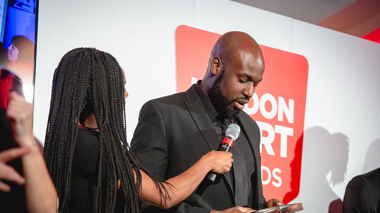 Franck Batimba receiving the Volunteer of the Year Award 2019