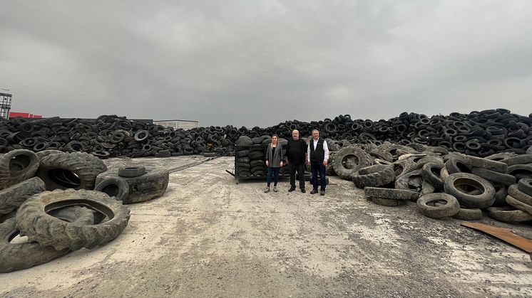 Members of the Nanografen team at a waste tyre disposal site.