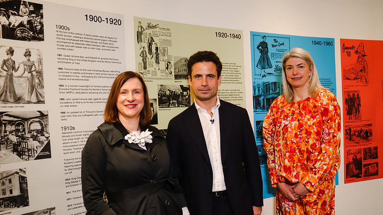 Emma Jane Goldsmith, Leo Fenwick and Kristen Pickering view the timeline at Exhibition 140. Image by Maddie Gunson