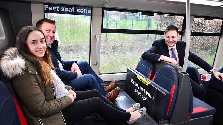 The ‘Feet Seat’ concept is demonstrated by Zoe Gibbons from Go North East's Customer Services team and Stephen King, Commercial Director, along with Managing Director Martijn Gilbert (right).