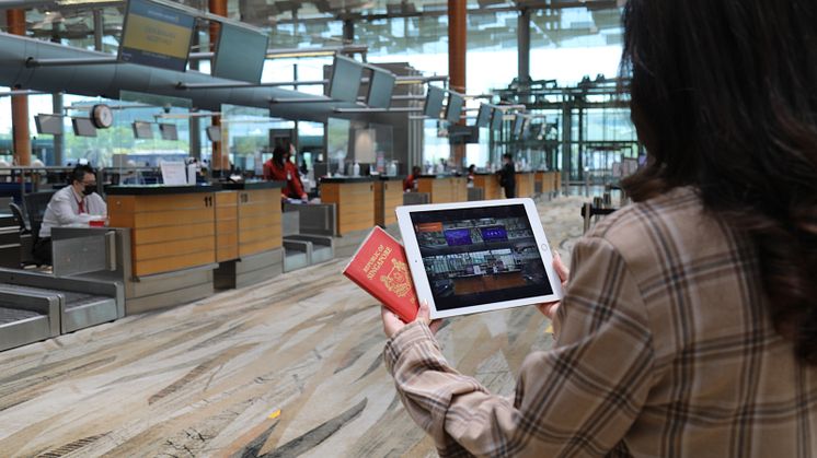 A passenger using the Changi Airport Social Story to help with her flight check-in.