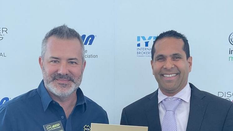 ACR Electronics - ACR's Mikele D'Arcangelo and Shawn Pariaug with the 2023 Miami Innovation Award for the ResQLink AIS PLB