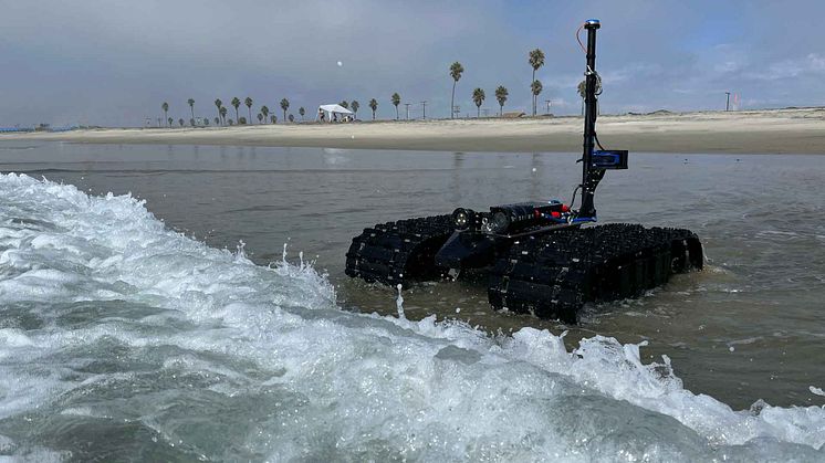 Bayonet amphibious ground vehicle transiting from the beach into the ocean