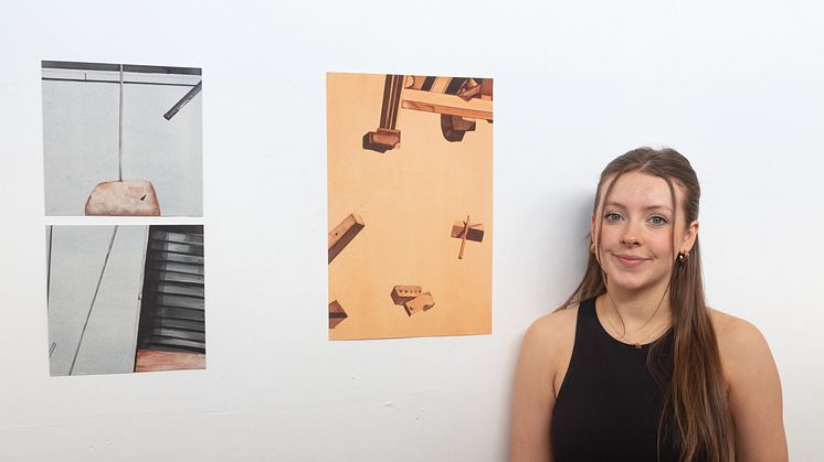 Freelands painting prize winner, Holly Smith, is pictured with some of her work.