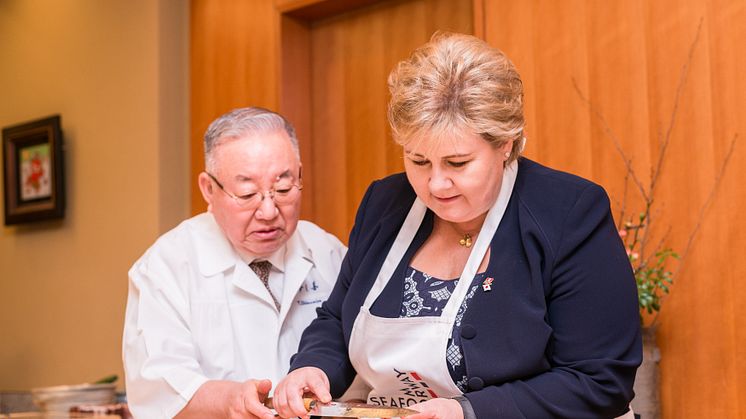 Norwegian Prime Minister Erna Solberg learns the art of sushi making from chef Tsutomu Shimamiya