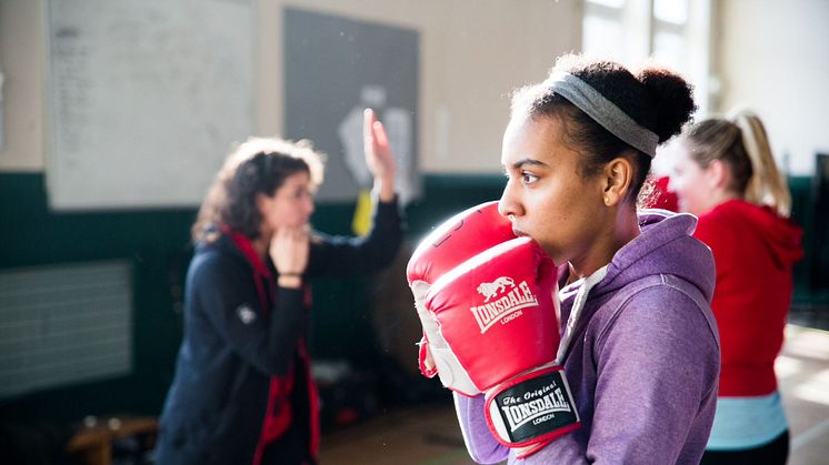 Young woman in a community boxing gym
