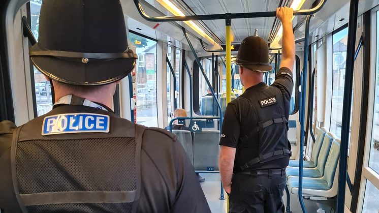 Officers patrolling trams