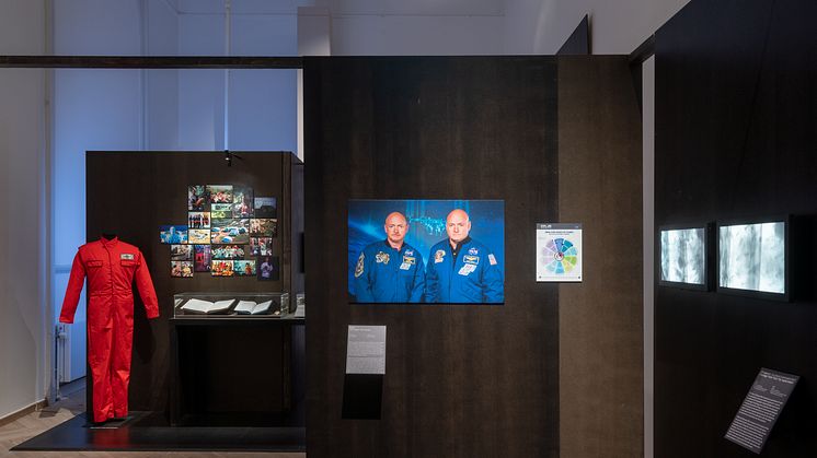 Material from Biosphere 2: Boiler suit, photos, log book, medal, 1991-94. NASA, The NASA Twin Study, 2015-16. Footage from fruit fly experiment, 2020