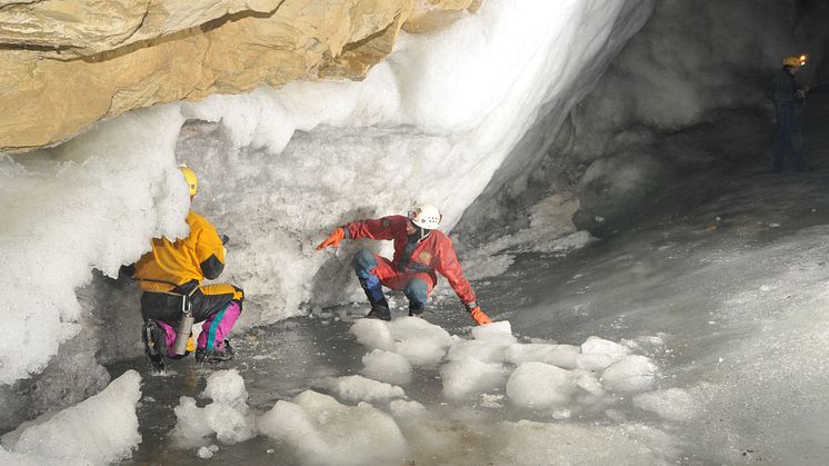 Dr Sebastian Breitenbach exploring possible passages in an ice-filled cave in Siberia