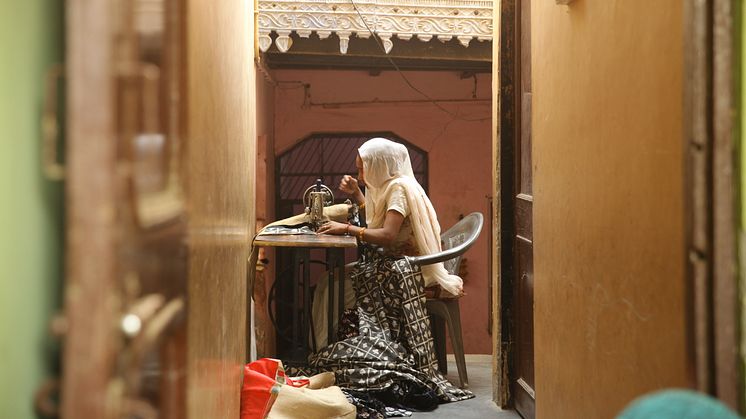 One of the self-employed female microfinance borrowers working in a center in Uttar Pradesh, a state in India.