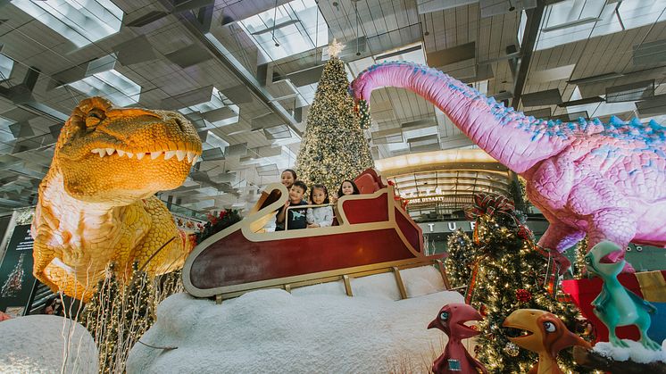 Capturing a moment among ginormous dinosaurs at Terminal 3’s festive display Dino Wanderland