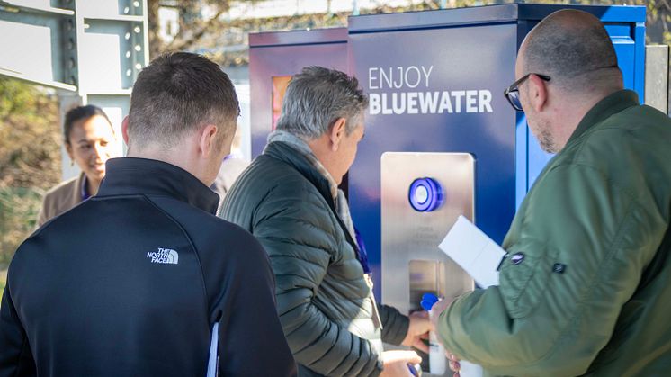 Rush to fill sustainable water bottles with Bluewater at 21st century EV recharging hub where single use plastic bottles of water are made a thing of the past