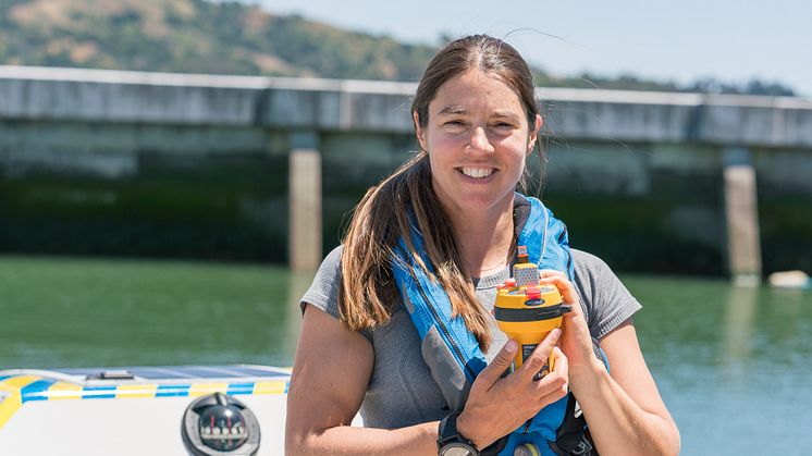 Ocean Signal-sponsored North Pacific solo rower Lia Ditton with her SafeSea E100G EPIRB