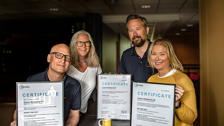 Proud: HSEQ Coordinator Ingunn Stensgård and CEO Stian Martinsen (in the back), Team leader Digital Lars Bratli and Head of communications, HR & ESG Eva Nordskog is proud to have achieved 3 ISO certifications. Photo: Heidi S. Middleton.