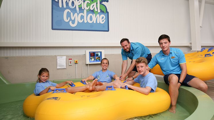 Ellie Simmonds and children from the local swimming club about to ride Tropical Cyclone.