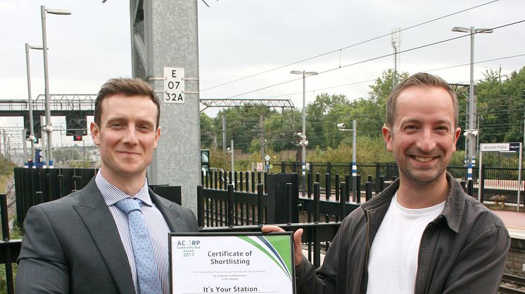 Winning smiles: Great Northern's Alexandra Palace Station Manager Martin Brown (left) presents Michael Solomon Williams with his certificate  High res version attached