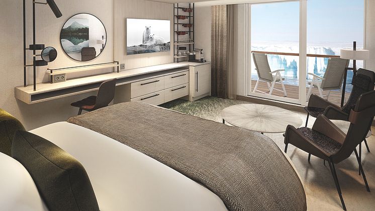 Ample workspace both inside the cabin or on the balcony onboard MS Roald Amundsen's Balcony Suites.