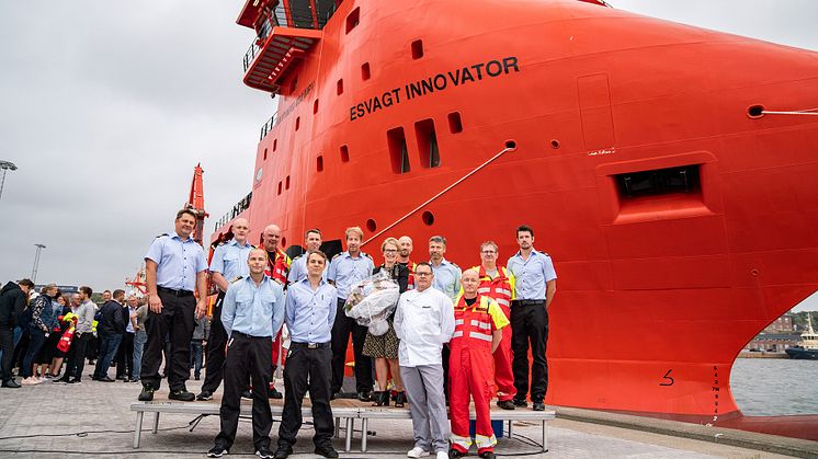 The crew in front of the top modern vessel 'Esvagt Innovator'