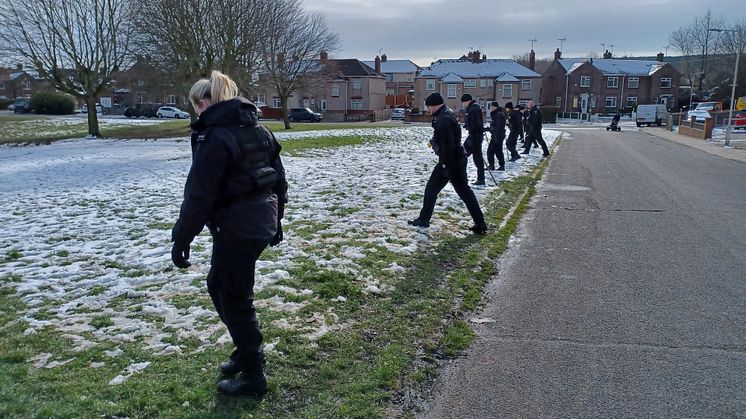 Officers searching the area close to where a police officer was assaulted in Mansfield Woodhouse.