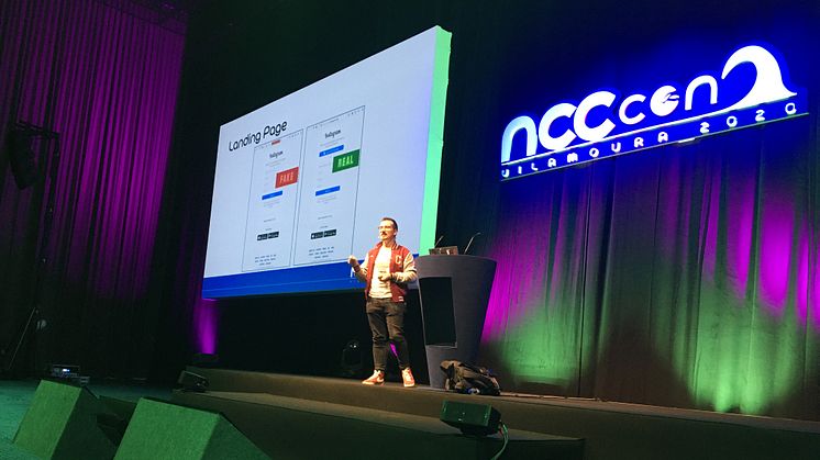 Giuseppe Trotta on stage at NCC Group's annual internal tech event - NCC Con