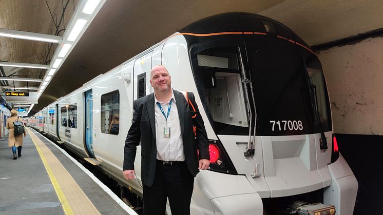 Driver Mark Webb in front of one of the first trains to run in passenger service digital in-cab signalling promising passengers a more reliable, greener service - More pictures below