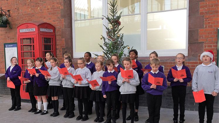 Southway Primary School children sang at Bognor Regis station.