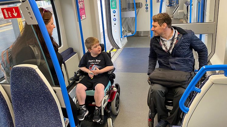 Ryan Horrod with his mum, Anne and Carl Martin on a Thameslink train at Brighton