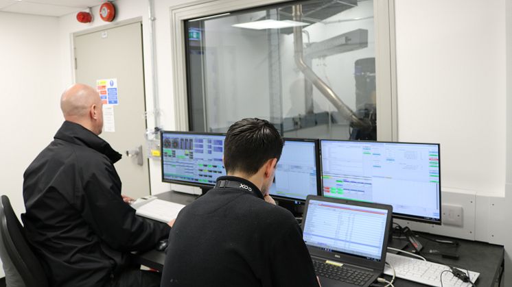 Cox Powertrain engineers analysing test data at company HQ in Shoreham-by-Sea, UK