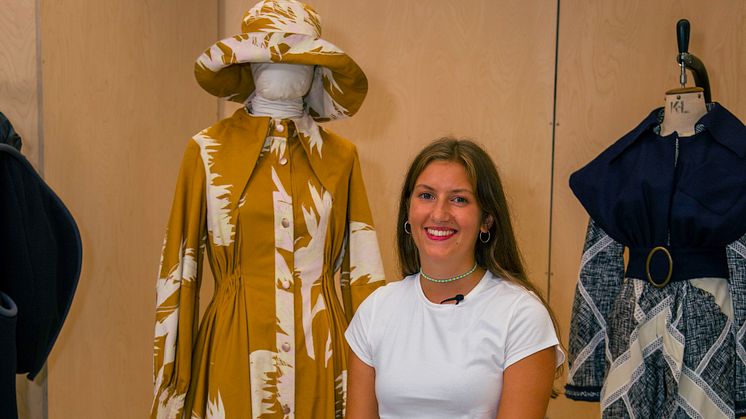 Fashion graduate Holly Hooker with her yellow outfit inspired by traditional smock frocks