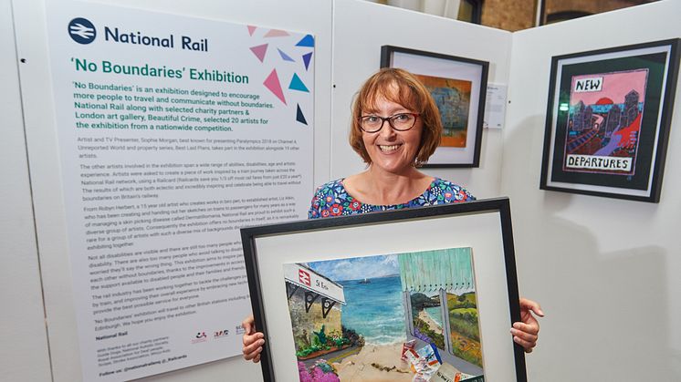 Artist Emma Johns and her artwork 'To the Lighthouse', which has been produced for the National Rail 'No Boundaries' exhibition