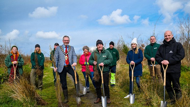 Pictured is the Mayor of Mid and East Antrim, Councillor William McCaughey, Paul Armstrong from the Woodland Trust and MEA Parks & Open Spaces staff planting the 58,000th tree.