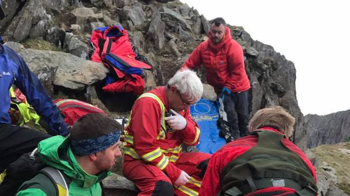 Medics attend to the woman hiker in her thirties who fell on Crib Goch ridge. Photo: Simon Duringer